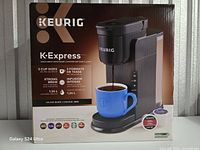 Front of sealed Keurig K-Express box showing product image and features