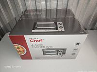 Front/top view of unopened Master Chef 4-slice toaster oven box