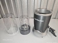 Front view of motor base, cups and blade