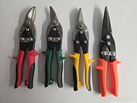 Front view of all four snips side-by-side on table