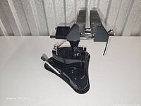 Right side view showing swivel head, jaws, vacuum base and lever