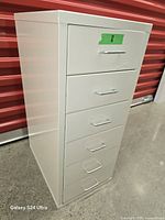 Front-angle view of white 6-drawer metal cabinet