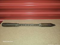 Full view of soldering iron showing handle, shaft and copper tip