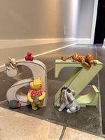 Front view of both bookends showing characters and letters