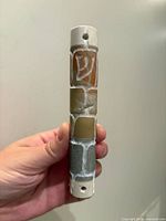 Front view showing multicolored stone blocks and carved Shin