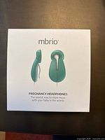 Front of box showing mbrio pregnancy headphones image and branding
