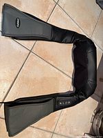 Full view of Naipo neck and shoulder massager laid flat