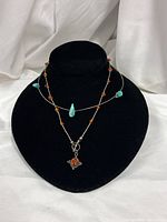 Both sterling necklaces displayed on bust