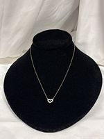 Necklace displayed on black bust showing overall look