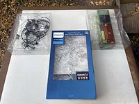 Overall lot with Philips topper centered and two string light sets left and right