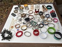 All bracelets laid out on white board