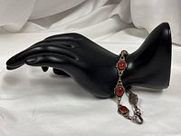 Full view of bracelet displayed on hand form showing design and length