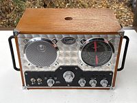 Front view showing speaker, tuning dial, controls