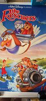 Full view of The Rescuers poster showing artwork and title