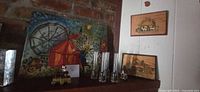 Overall lot showing plaques, painting, shot glasses, birdhouse