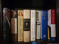 Spines of eight hardcover presidential history books