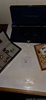 Overview of open earring case, necklace box and ring tray