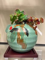 Front view of Ryland pottery planter with faux succulent