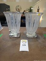 Front view of both Verly crystal vases on square bases