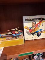 Helicopter and book on shelf