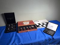 Overview of all four boxed entertaining sets on table