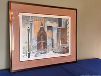 Framed print full view at angle showing image, mat, frame