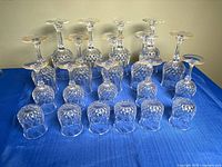 Full set of 20 glass goblets arranged upside down