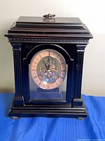 Full view of black Bombay Company mantel clock