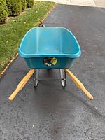Front view of Yardworks turquoise wheelbarrow