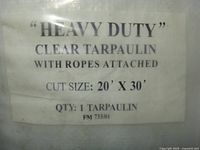Label showing heavy duty clear tarpaulin 20' x 30'