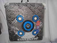 Front view of Steel Stop archery target bag showing bullseye graphics and handle