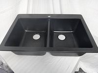 top view of black composite double-bowl sink