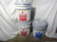Three pails stacked showing two ProMar 400 flat and one ProMar 200 semi-gloss