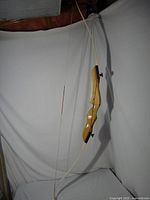 Full view of assembled recurve bow suspended