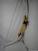 Full side view of assembled recurve bow showing overall length and limb curvature