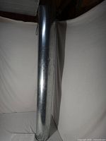 Full view of one galvanized 4 in round duct pipe standing upright