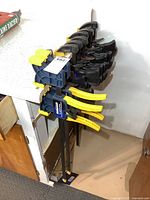 Front view showing entire collection of clamps hanging