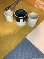 Three crocks side by side