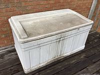 Front view of Suncast resin deck box showing size and condition
