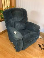 Front left view of blue La-Z-Boy rocker recliner