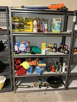 Full view of shelving rack with contents (not included) showing four shelves and metal frame