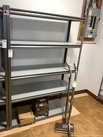 Front view of full shelving rack showing four shelves and metal frame