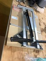 Trim Tramp saw guide with rails and angle gauge on workbench