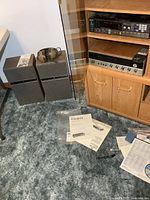 Receiver and speakers with headphones and manuals in situ