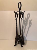 Full view of stand with four tools hanging