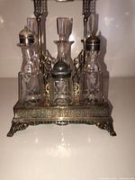 Front view of cruet set showing stand and glass containers