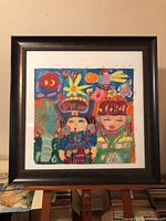 Front view showing entire framed painting with colourful imagery