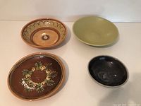 All four ceramic bowls displayed top view