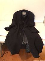 Overcoat laid flat showing overall style and length