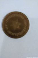 Obverse showing star design and centennial legend